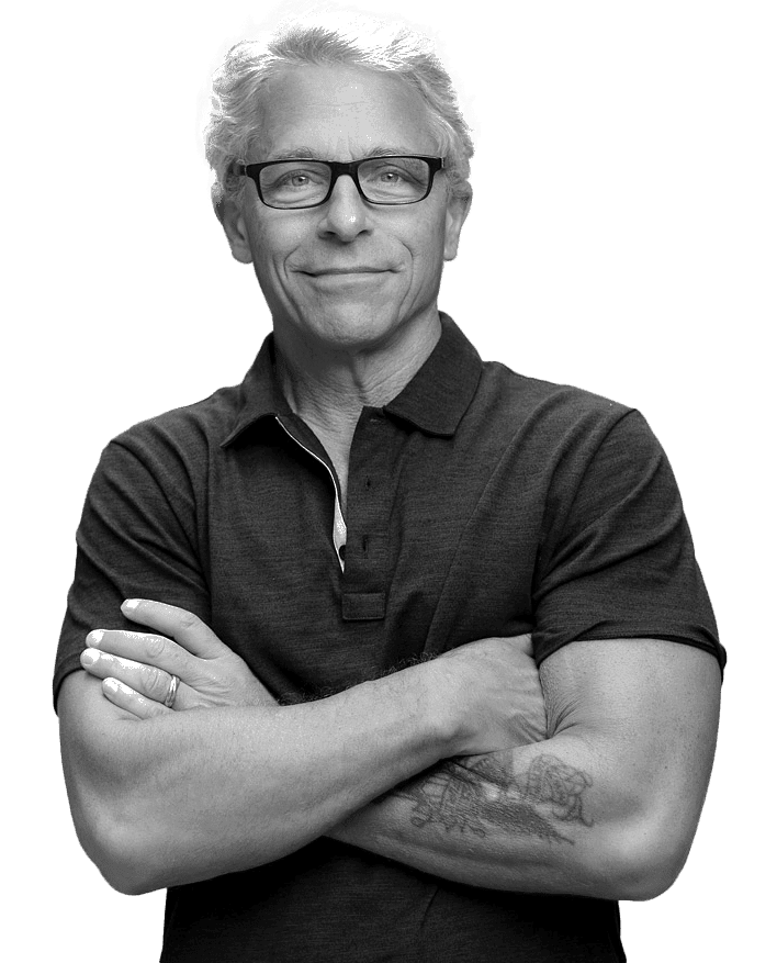 Michael Maddaus, arms crossed, looking at the camera